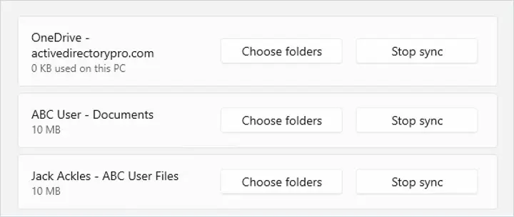 Account tab in OneDrive settings with Stop sync beside each synced account