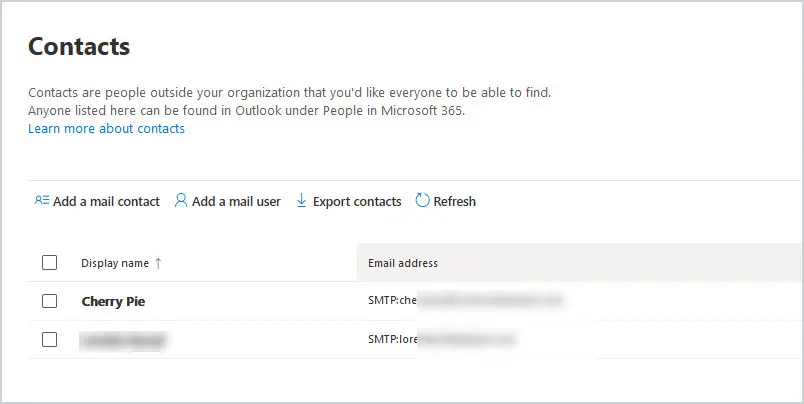 Exchange admin center recipients page showing the tenant contact list